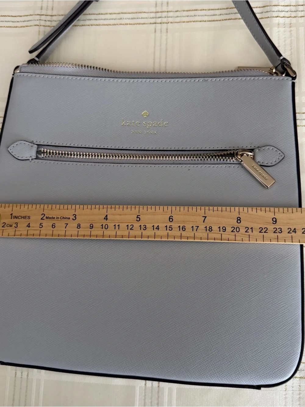 kate spade light gray saffiano leather messenger bag with gold hardware